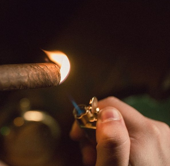 Lighting a cigar in low light